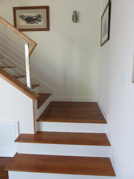 Stair-Treads-Stained-to-match-hardwood-Risers-Painted-by-Customer